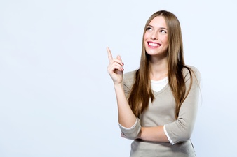 beautiful-young-woman-pointing-up-over-white-background_1301-7744